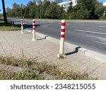 View of the road posts separating the parking lot from the road