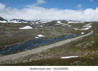 View Of Road And Railway Line On Rallarvegen. Famous Bicycle Trail On Hardangervidda Plateau Leads You Along The Bergen Railway Line From Haugastøl To Flåm. Norway