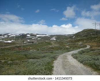 View Of Road And Railway Line On Rallarvegen. Famous Bicycle Trail On Hardangervidda Plateau Leads You Along The Bergen Railway Line From Haugastøl To Flåm. Norway