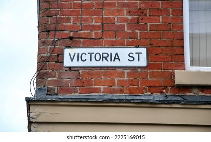 A View Of The Road Sign At The End Of Victoria Street