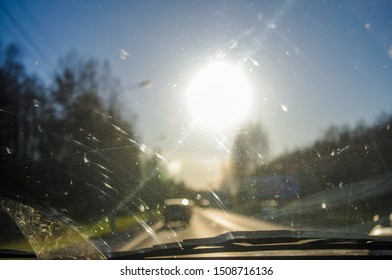 View Of The Road And The Sun From The Dusty Car Window