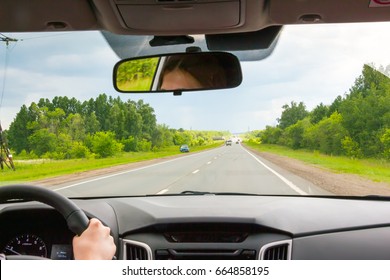 View Of The Road Through The Windshield Of The Car