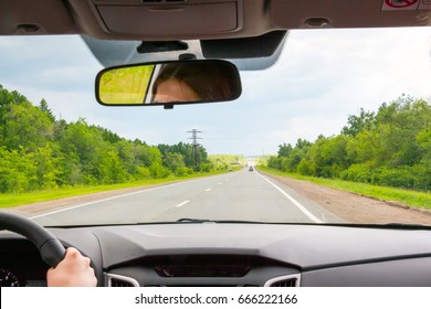 View Of The Road Through The Windshield Of The Car