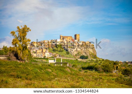 View of rock castle, abbey and village of Motta Santa Anastasia in Sicily, Italy