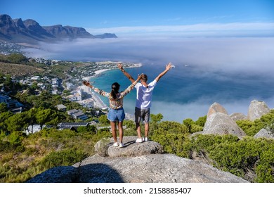 View from The Rock viewpoint in Cape Town over Campsbay, view over Camps Bay with fog over the ocean. fog coming in from the ocean at Camps Bay Cape Town South Africa - Shutterstock ID 2158885407