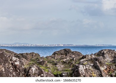 View Of Rocks, Ocean And Victoria, Canada Skyline