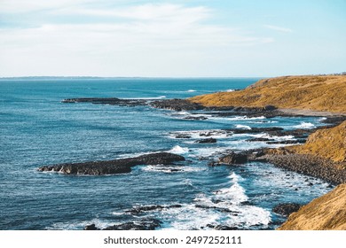 View of rocks and wave splashes at Phillip Island, Victoria, Australia