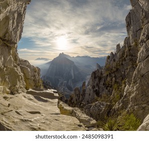 View of the rocky cliffs and mountainous landscape of Monterrey at sunrise, with the sun casting a golden glow over the rugged terrain. The distant peaks create a dramatic backdrop against the morning - Powered by Shutterstock