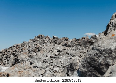 view of a rocky ground on alpine level in the mountains on a sunny day