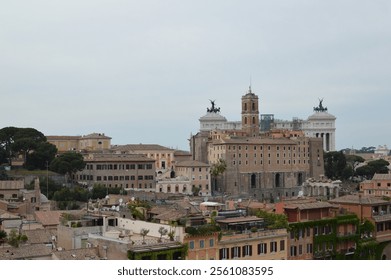 View of Rome's historical center featuring rooftops, colorful buildings, and the iconic Vittorio Emanuele II Monument in the distance under a cloudy sky - Powered by Shutterstock