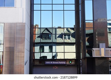 View Of Roofs Reflecting On The Glass Of A Modern Building On 14th Street NW In Washington, DC, USA