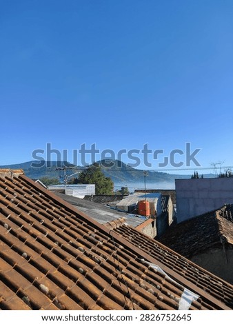 the view of rooftiles and mountains