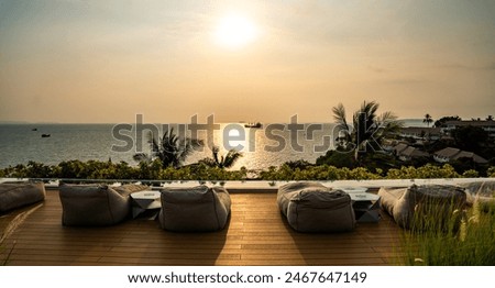 View of rooftop bar at sunset in Cape Panwa beach in Phuket, Thailand