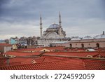 View of the rooftops of the Grand Bazaar with mosque in the background. Historical buildings of Istanbul.