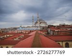 View of the rooftops of the Grand Bazaar with mosque in the background. Historical buildings of Istanbul.