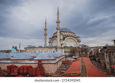 View of the rooftops of the Grand Bazaar with mosque in the background. Historical buildings of Istanbul.