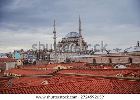 View of the rooftops of the Grand Bazaar with mosque in the background. Historical buildings of Istanbul.