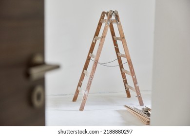 View Of The Room With A Wooden Ladder In The Room When Painting The House