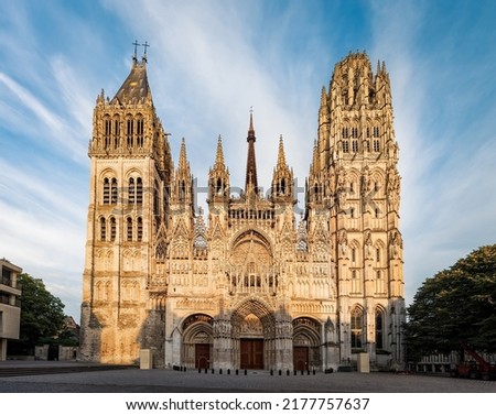  View of Rouen Cathedral facade at sunset.