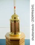 View of a round brass domed tabernacle in a Catholic church