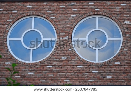 View of round windows on brick wall