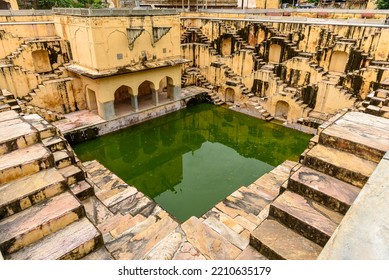 View of Ruined Panna Meena ka Kund , a Historic stepwell  rainwater catchment known for its picturesque symmetrical stairways. - Shutterstock ID 2210635179