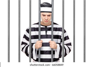 A View Of A Sad Prisoner In Jail Holding Bars Isolated On White Background