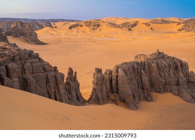 view in the Sahara desert of Tadrart rouge tassili najer in Djanet City  ,Algeria.colorful orange sand, rocky mountains - Shutterstock ID 2315009793
