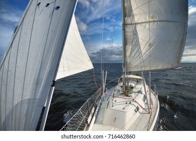 View From A Sailboat's Bow With Mast And Full Sails