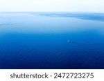 View of the sailing yacht on the blue Mediterranean Sea, seen from Majorca Island, Spain