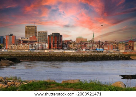 View of Saint John, New Brunswick, in the evening on the Bay of Fundy in the Maritime Provinces of Canada with beautiful colorful sunset