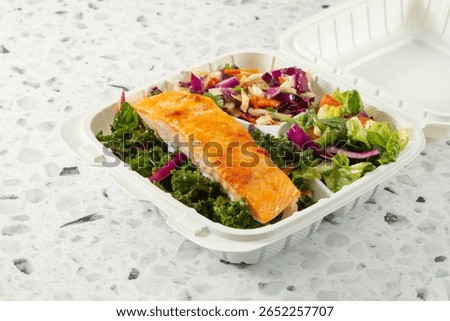 A view of a salmon salad entree.
