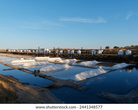 View of salt fields after a full day of collecting salt. Nice vibrant colors. Salt fields in Castro Marim, Portugal. Salt extraction.