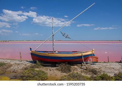 View of the salt pans in Gruissan in the south of France. In the front a colorful boat.