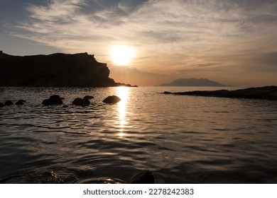 View of Samothrace island from Yildizkoy (Arcadia) beach in Imbros Island at sunset with cloudy sky. Gokceada, Çanakkale Turkey - Shutterstock ID 2278242383