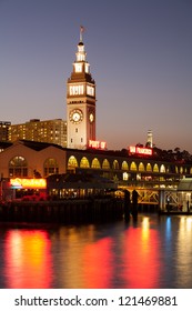 A View Of San Francisco With Ferry Building At Night