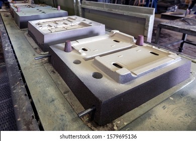 View of the sand molds on the production line for metal casting. Sand casting is a type of expendable mold casting that utilizes expendable sand molds to form complex metal parts. - Powered by Shutterstock