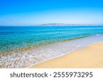 View of sandy Plaka beach and blue sea, Naxos island, Cyclades, Greece