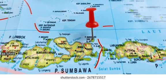 View of Sangeang Api, is an active complex volcano on the island of Sangeang in Indonesia, It consists of two volcanic cones, 1,949 metres Doro Api and 1,795 m Doro Mantoi, marked with red push pin