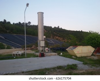 View Of A Sanitary Landfill Including A Biogas Flare, Hdpe Pipes, A Skip Container And The Cell Covered With Geo-textile Membrane