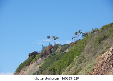 View of the Santa Barbara bluffs right above the Pacific ocean beach with blue sky above