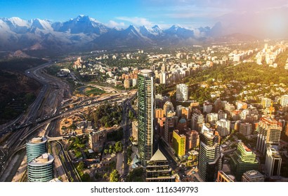 View Of Santiago De Chile With Los Andes Mountain Range In The Back At Sunset Time