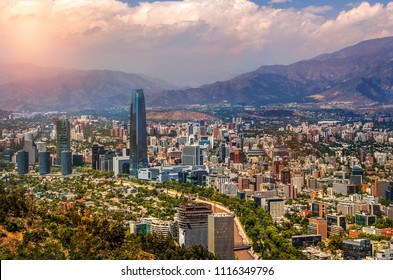 View Of Santiago De Chile With Los Andes Mountain Range In The Back At Sunset Time