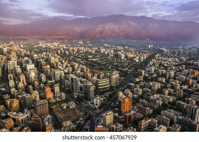 View Of Santiago De Chile At Sunset Time With Los Andes Mountain Range In The Back