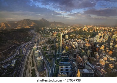 View Of Santiago De Chile At Sunset Time With Los Andes Mountain Range In The Back