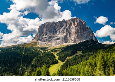 View of Sassolungo Langkofel mountain from Selva. Gardena Pass, Trentino Alto Adige, Italy. Gardena Pass with Sassolungo mountain in background between Val Badia and Val Gardena, South Tyrol, Italy