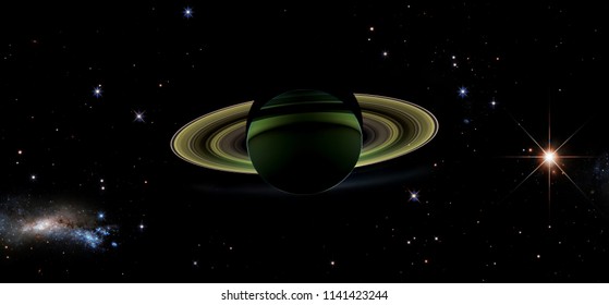 View of Saturn from its shadow with stars. Cassini satellite Saturn mission . Elements of this image furnished by NASA. - Powered by Shutterstock