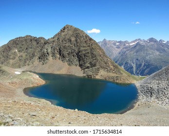 View Of The Schwarzsee In The Ötztal Alps Over Sölden In Tirol Austria. The View Is From The Trak To The Summit Of Schwarzkogel