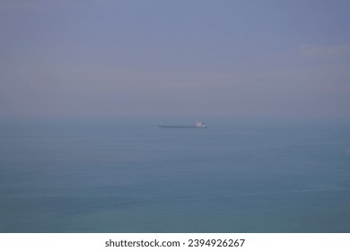 View of the sea and cargo ships at Tsin Yue Wan Campsite 煎魚灣營地, Lantau Island, Hong Kong