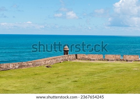 View to the sea with the puerto rico guard vigilance tower with green field from el morro in san juan known as 